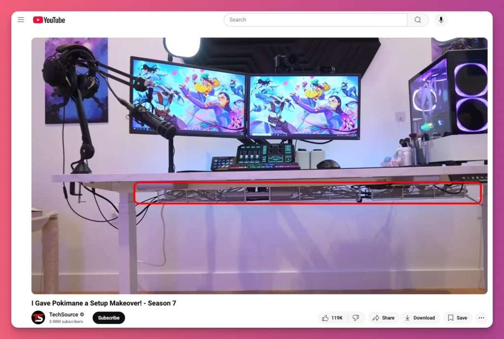 Pokimane's game setup features a tidy, well-organized cable management system under the desk for her dual monitor setup